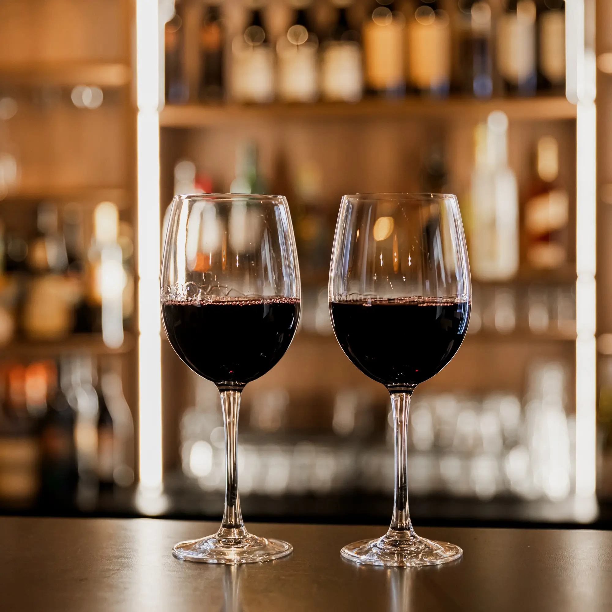 Two glasses of wine on the bar of Paladino's Cucina.